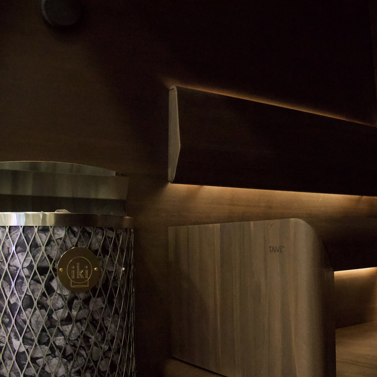 IKI Wall 6 kW sauna heater in a sauna interior