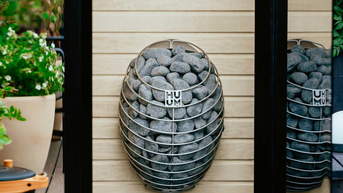 HUUM DROP sauna heater installed in a sauna