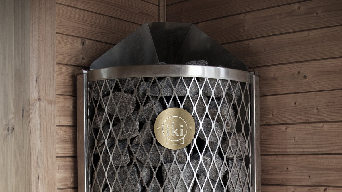 IKI Corner 6 kW sauna heater installed in a home sauna
